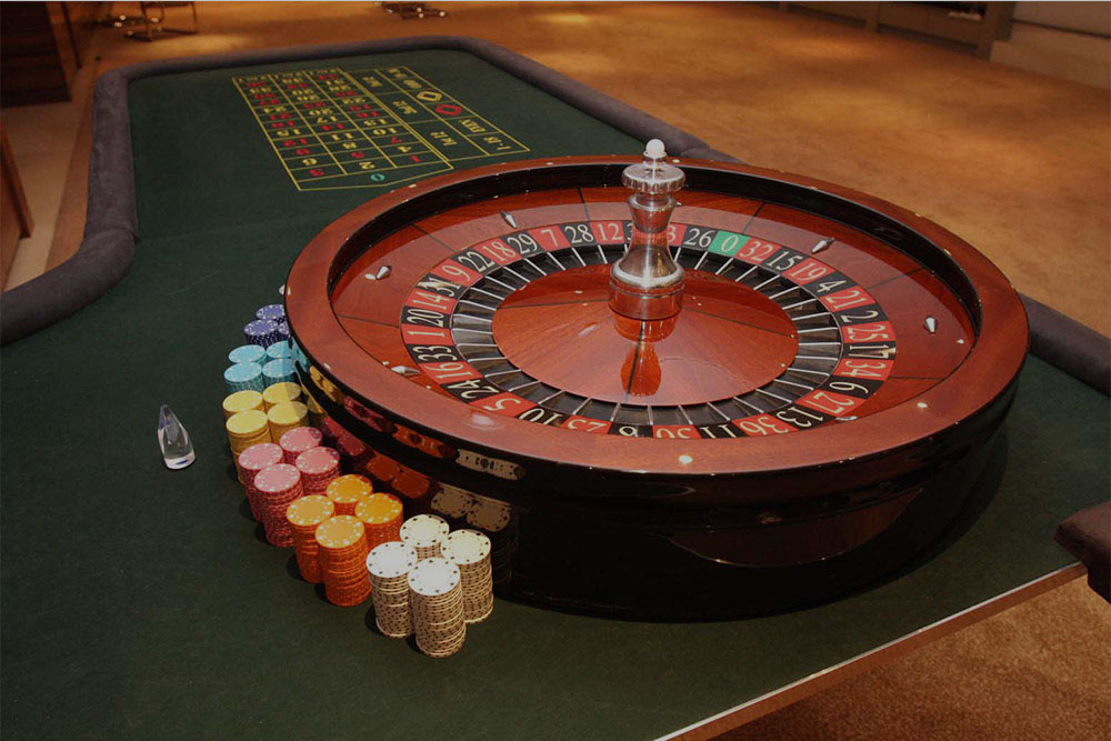 Fun casino tables set up in an event venue before guests arrive